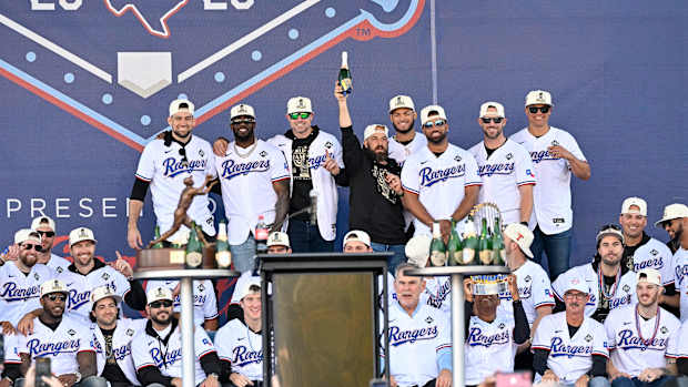 The Texas Rangers pose for a photo during the celebration outside of the ballpark after the World Series championship parade at Globe Life Field.